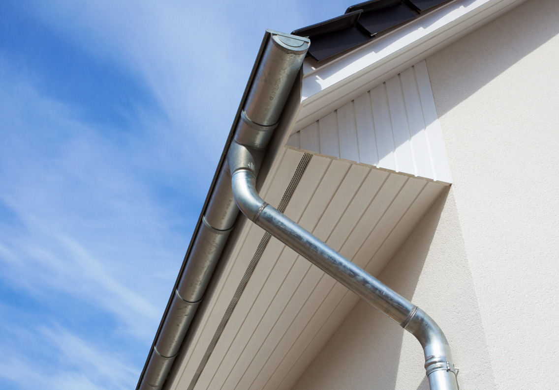 beauty shot of gutters and downspot